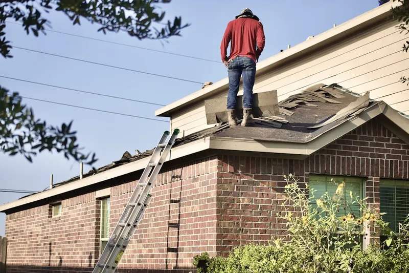 Professional roofer working on a residential roof in Sturgeon Bay